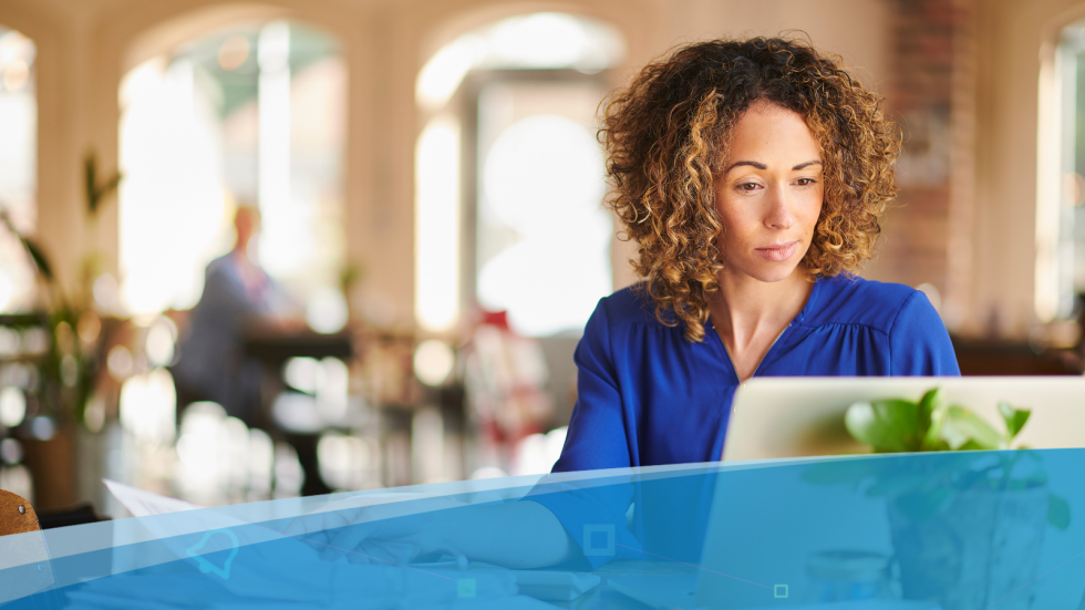 Woman working remotely in a café